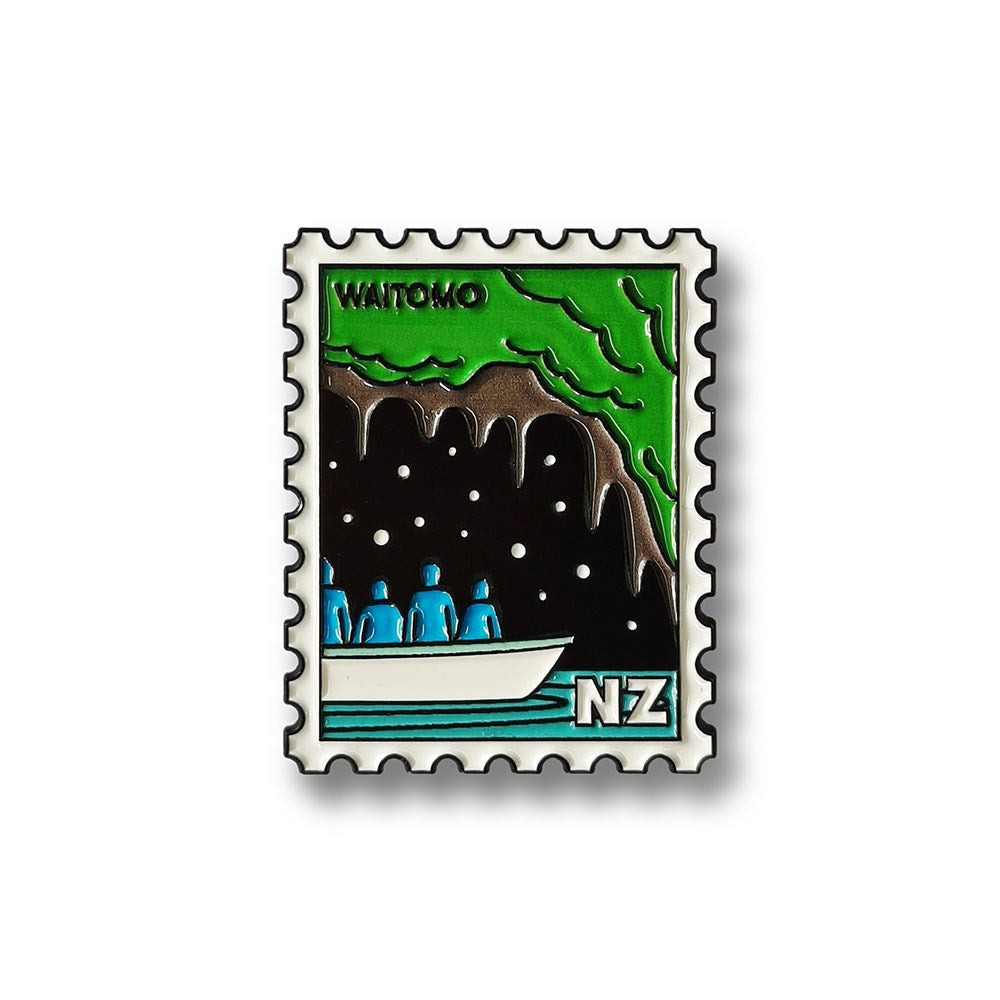 The Waitomo Collectible Stamp Magnet features Glenn Jones’ stylized illustration of four people boating in a dark glowworm cave, with “WAITOMO” and “NZ” on the design—a unique New Zealand collectible.