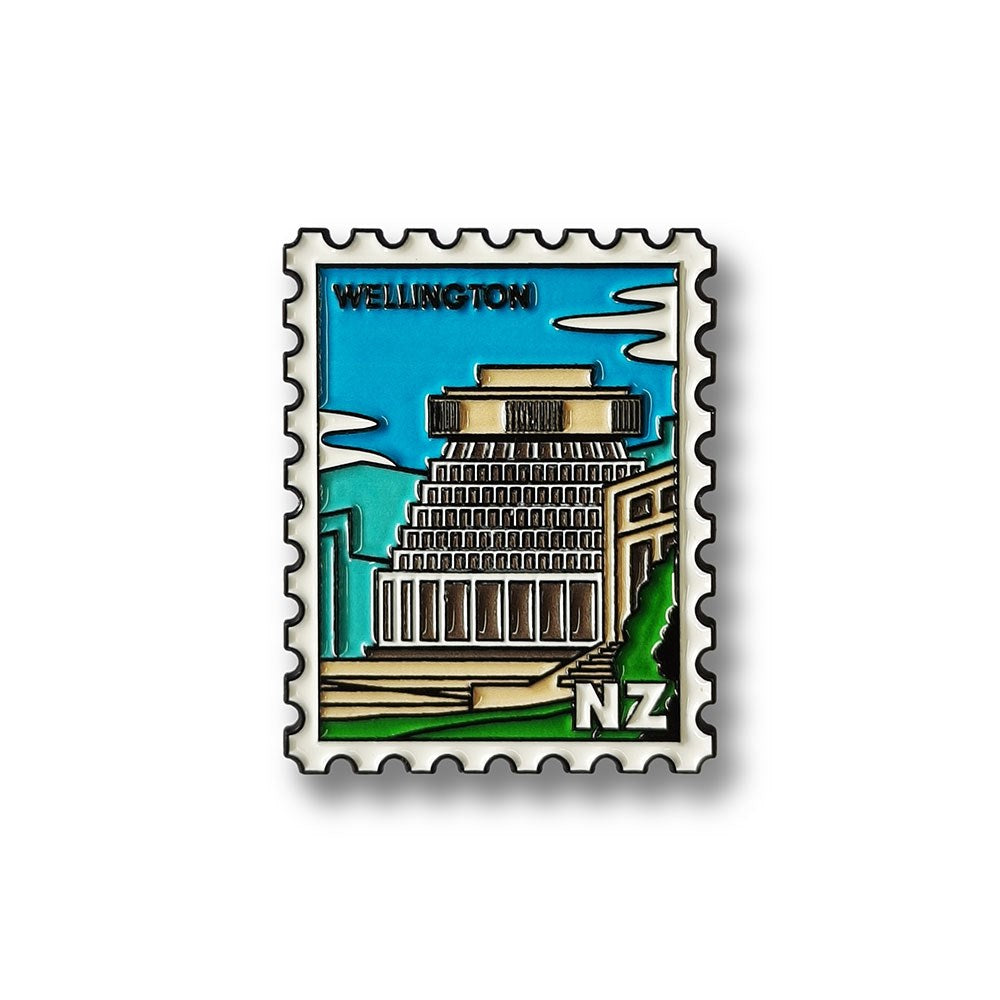 This Wellington Collectible Stamp Magnet features the Beehive under a blue sky, with “Wellington” at the top and “NZ” in the corner—an iconic Glenn Jones Artwork design inspired by postage stamps.