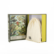 An open box reveals the NZ Native Bird Jigsaw Puzzle (1000 pieces), an illustrated book cover featuring native birds, and a cream-colored drawstring bag.
