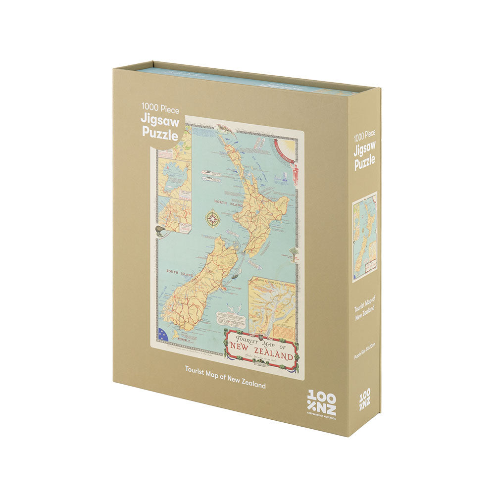 A beige box labeled Tourist Map of NZ Jigsaw Puzzle contains 1000 pieces and features an illustrated vintage New Zealand map on the front, with product branding in the bottom right corner.