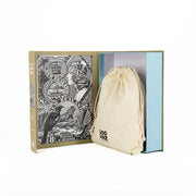 The Stamps of New Zealand Jigsaw Puzzle Box opens to show a cloth drawstring bag inside. The box’s left side displays detailed black and white vintage art of New Zealand bird stamps, adding an elegant collectible feel.