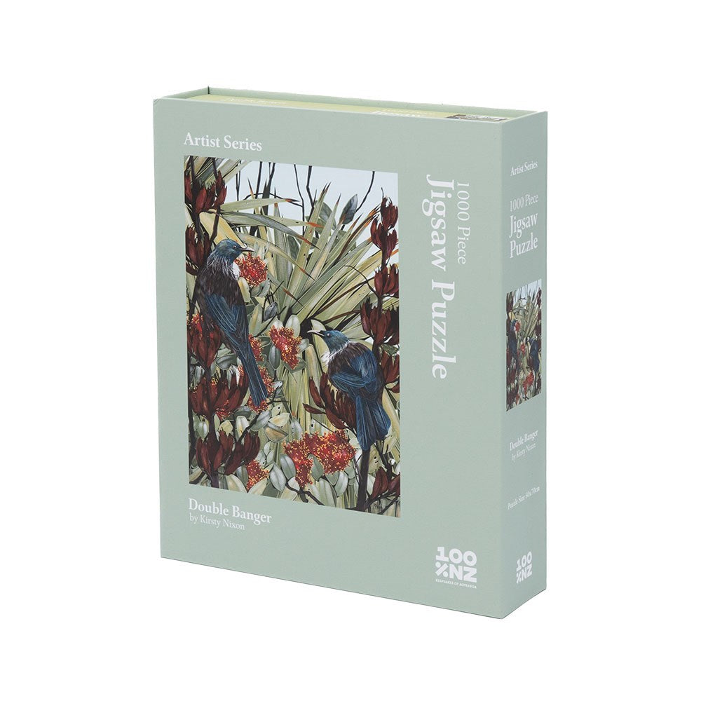 A rectangular box of the 1000-piece Kirsty Nixon - Double Bangers Jigsaw Puzzle, featuring birds and native plants from the Artist Series on the front cover.