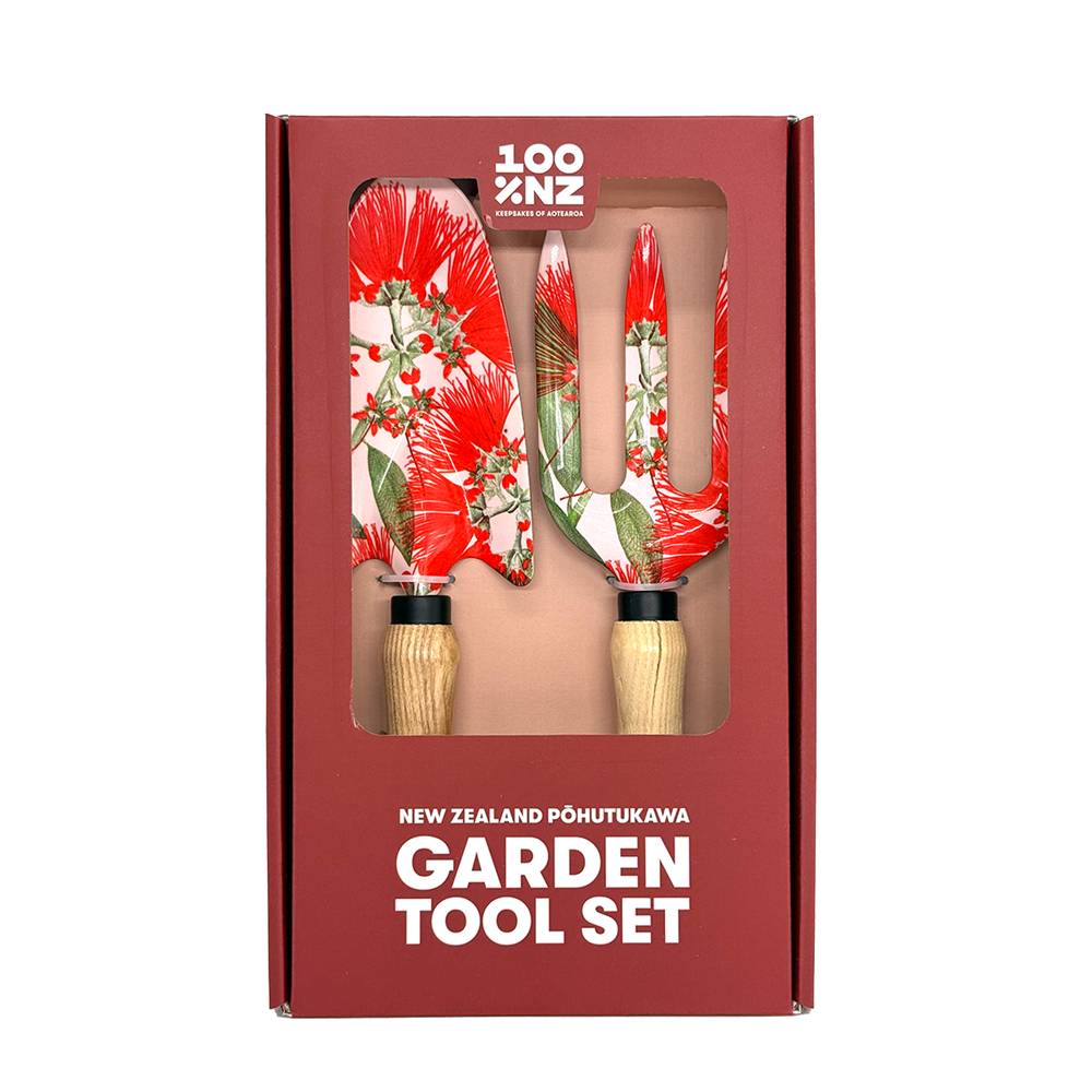 The NZ Pohutukawa Garden Tool Set includes a trowel and fork with ash wood handles and red and green floral patterned blades, packaged in a box labeled New Zealand Pōhutukawa Garden Tool Set.