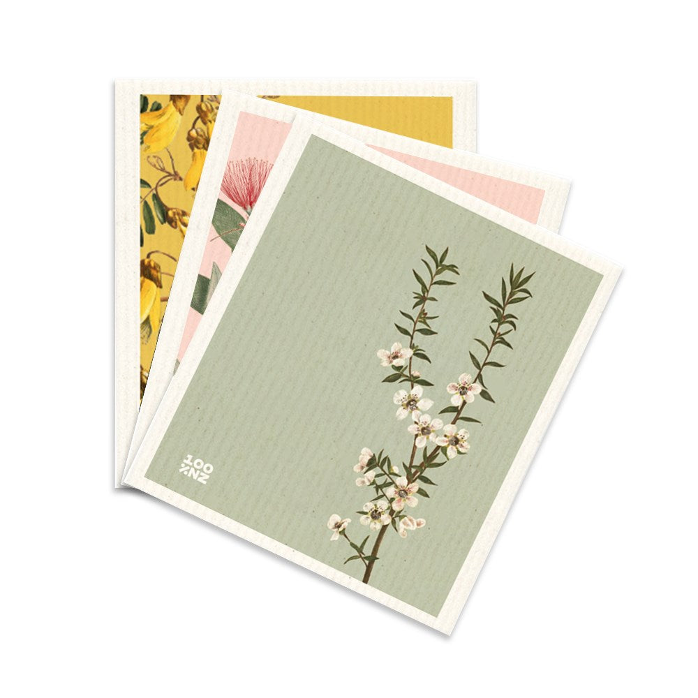 Three eco-friendly Swedish Dishcloths - Vintage Botanicals, each with a unique floral illustration on pastel backgrounds. The top cloth is green with white flowers and Zooninz in small white text.