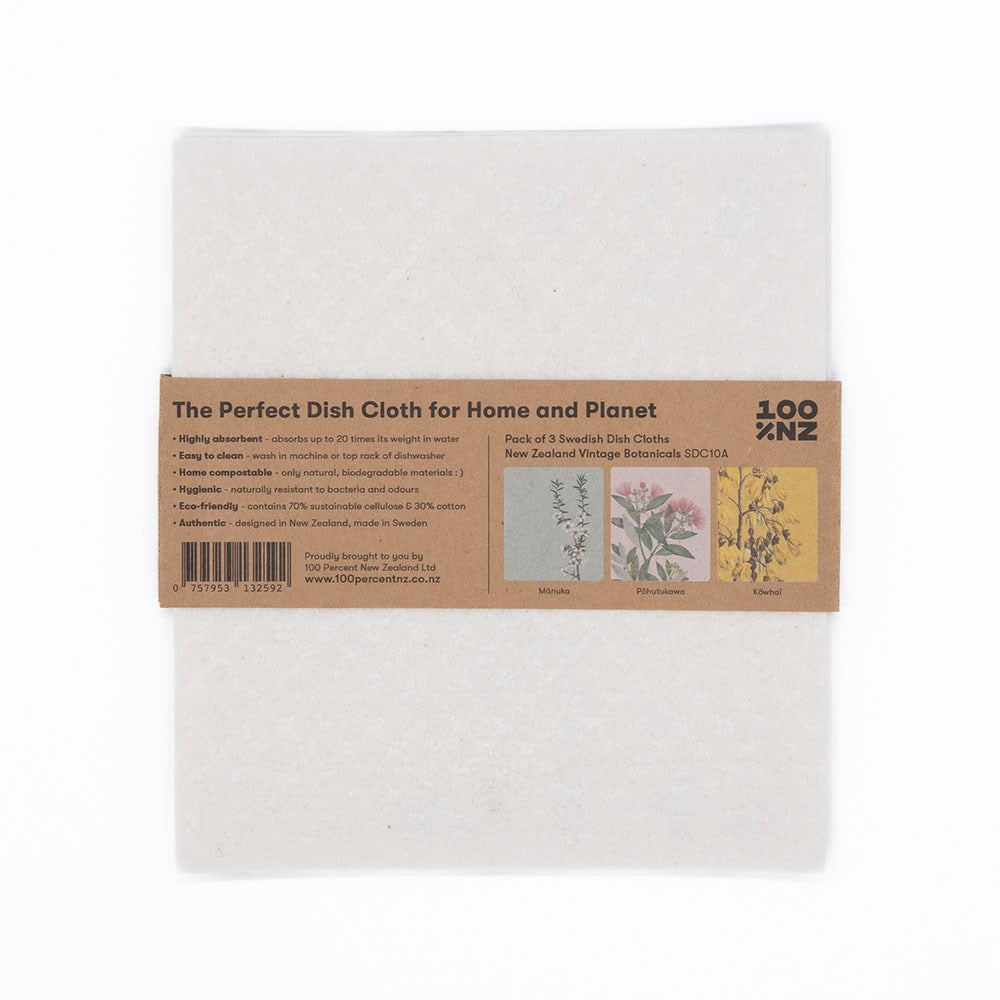 A pack of three Swedish Dishcloths - Vintage Botanicals wrapped in a brown paper label featuring product info and botanical illustrations. The white cloths have a subtle textured pattern.
