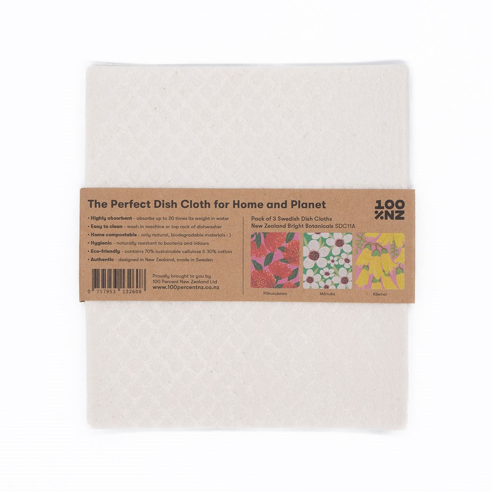 A pack of three Swedish Dishcloths - Bright Botanicals in brown paper packaging with product details and vibrant floral designs—Flowerbed, Wildhaus, and Meadow—for a sustainable cleaning choice.
