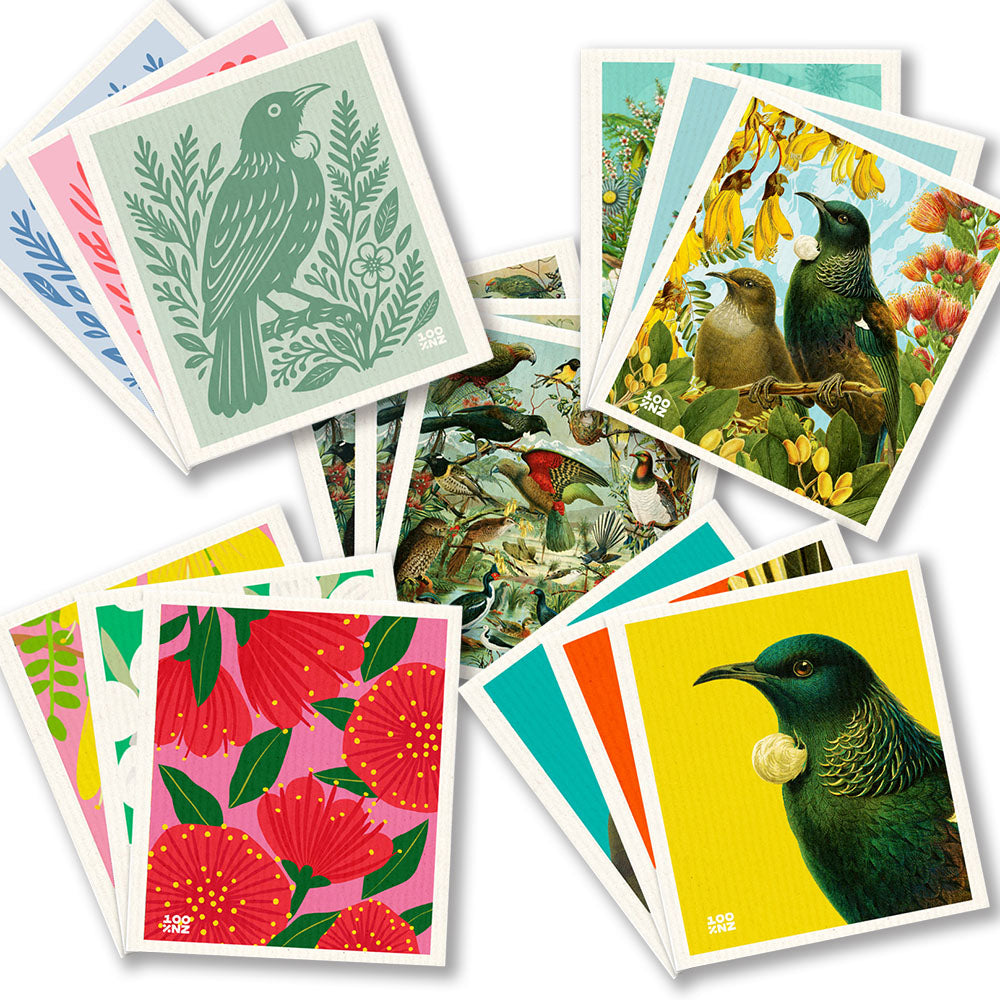 The Stock Up & Save collection features colorful square cards with dishcloth-inspired designs—stylized birds, florals, and nature scenes—displayed in a scattered pile on a white background.