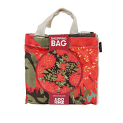The Vintage Pohutukawa Shopping Bag is an affordable, lightweight folded fabric bag with handles, labeled “Shopping Bag” featuring a red floral design with green leaves and the word Pohutukawa at the bottom.