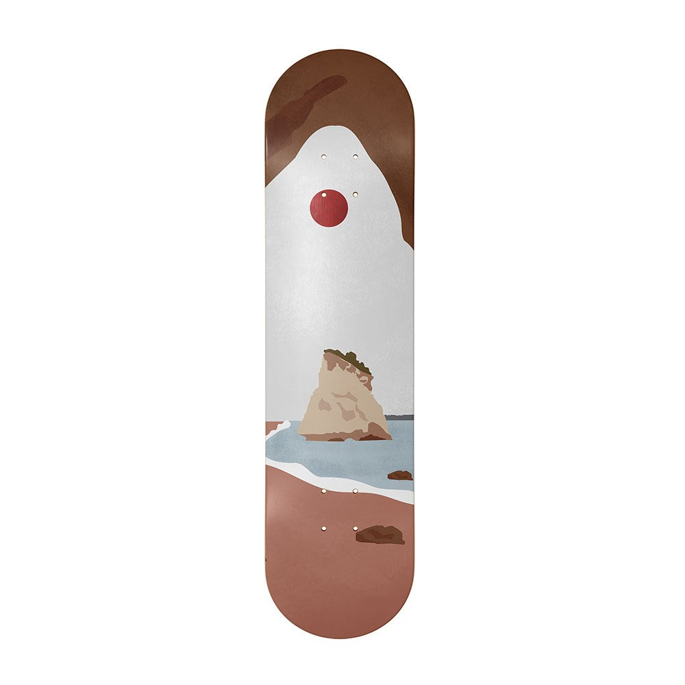 The Cathedral Cove Landmark Skateboard Deck is crafted from Canadian maple and features an abstract rocky seaside scene with a brown arch, red sun or moon, water rock formations, and sandy foreground—perfect for contemporary art lovers.