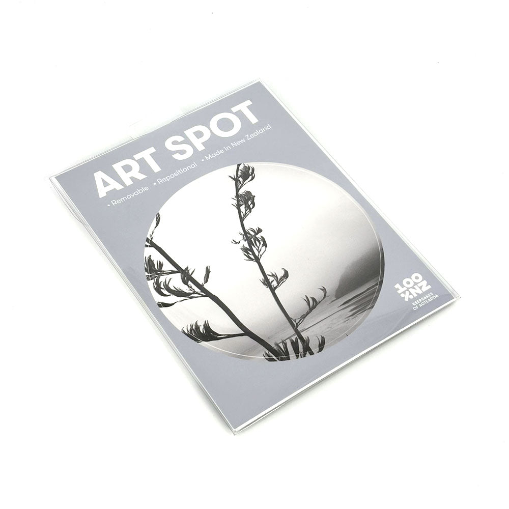 The Paihia Art Spot is a rectangular package labeled with a black and white circular plant image. It reads Removable, Reusable, Made in New Zealand, 100% at the bottom right and highlights a matte fabric finish for repositionable wall art.