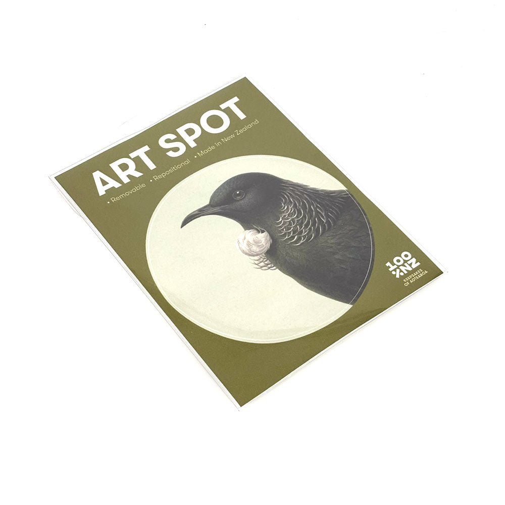 A postcard titled Hushed Green Tui Art Spot features a black bird with white throat feathers on a green background. Printed on matte fabric finish, it has 100 Years of Forest & Bird text at the bottom right.