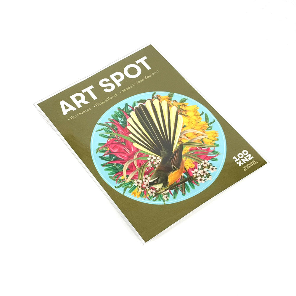 The Botanical Fantail Art Spot magazine features a bird with yellow and black tail feathers on a floral plate. The cover highlights Tauranga, Papamoa, Made in New Zealand, and repositionable matte fabric wall art.