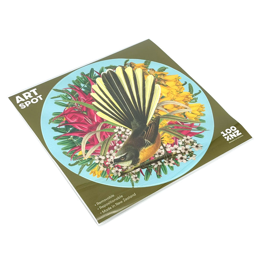 The Botanical Fantail Art Spot is a square print showcasing a stylized bird with fanned tail feathers and vibrant flowers. This matte fabric wall art is repositionable, surface-safe, “100% Aotearoa NZ,” and responsibly made in New Zealand.