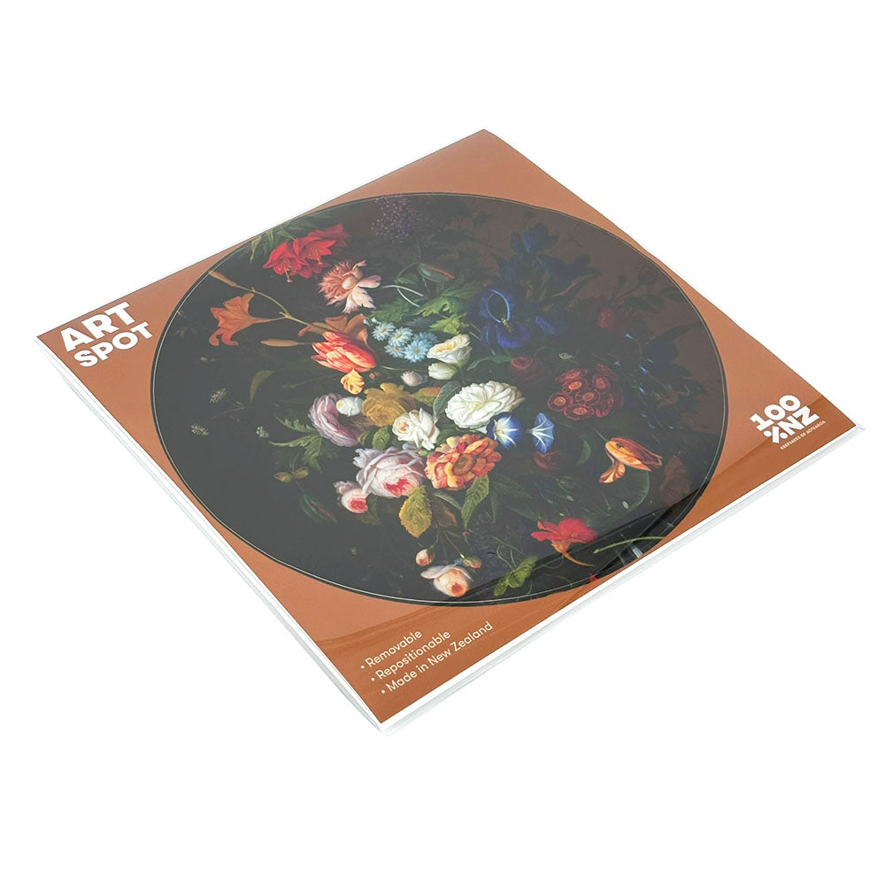 The Vintage Flowers Art Spot is a square art print with a brown border and a circular image of colorful flowers. It features ART SPOT and 100% NZ text, has a matte fabric finish, and is removable, reusable, and made in New Zealand.