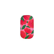 The Bright Botanical Pink Pohutukawa Trinket Box features a pink background, large red flowers, green leaves, yellow dots, and tiny jewelry-inspired accents.