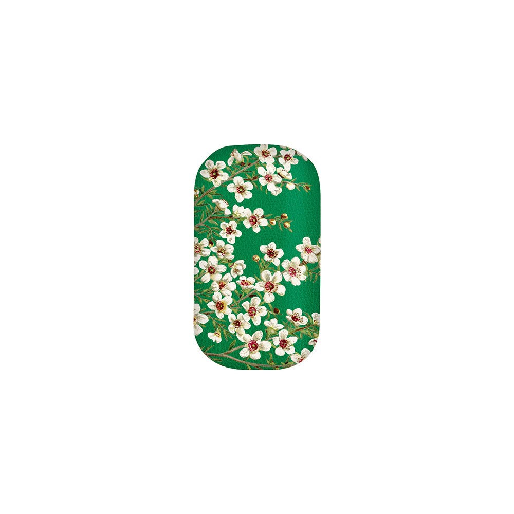 The Manuka Flower Trinket Box is a rectangular, rounded-corner case with a green background and white flowers with red centers and green leaves—perfect for compact earphone storage.