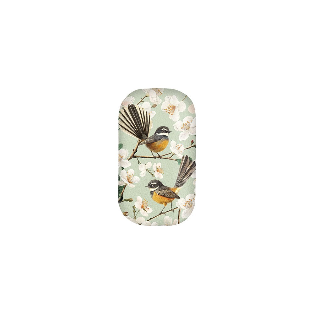 The Chatty Fantails Trinket Box is a rectangular case with rounded edges, featuring two long-tailed birds on branches with white flowers set against a light green background.