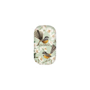 The Chatty Fantails Trinket Box is a rectangular case with rounded edges, featuring two long-tailed birds on branches with white flowers set against a light green background.