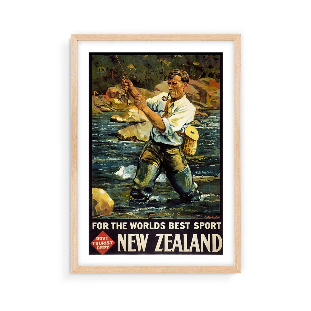 The Worlds Best Sport Tourist Print is a vintage-style collectible poster of a man fly fishing in a rocky, tree-lined river with For the worlds best sport, New Zealand. Govt Tourist Dep. at the bottom and comes in a light wood frame.