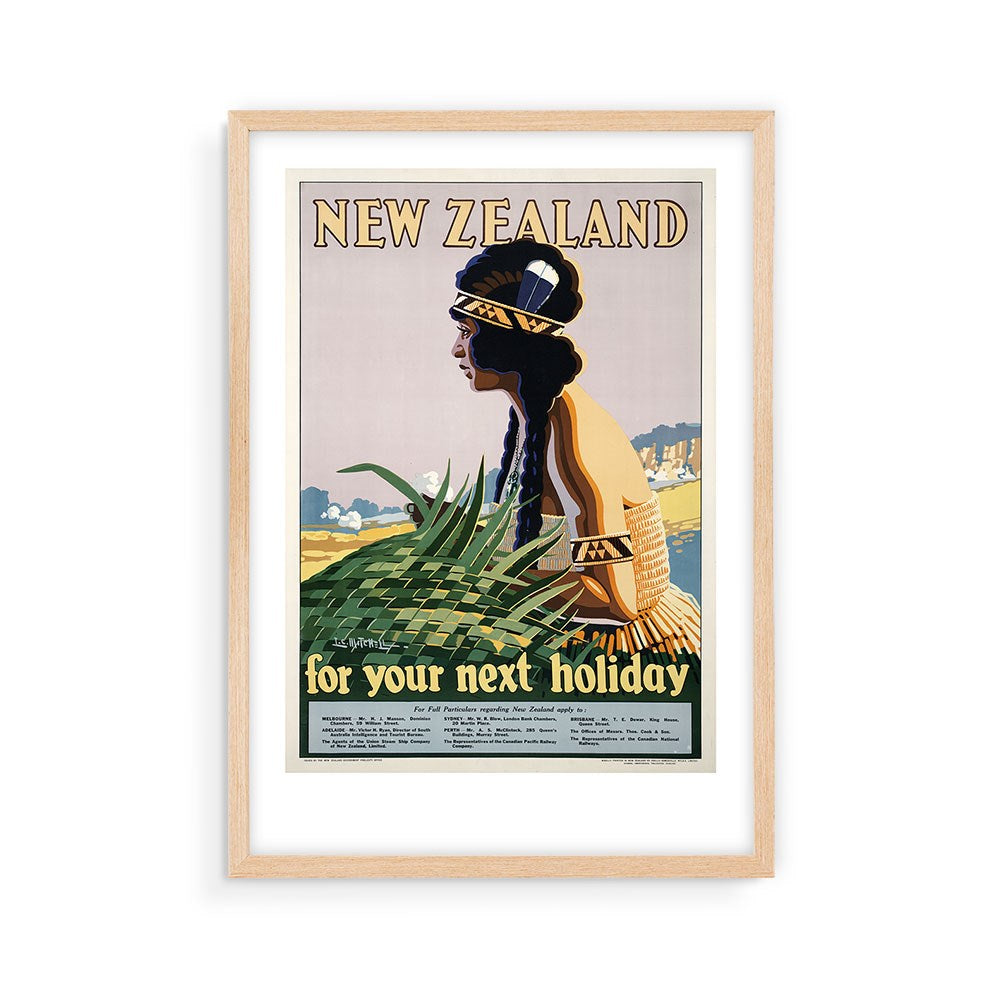 The NZ Holiday Tourist Print is a framed vintage travel poster of a woman in Māori attire with woven flax, set against a scenic background and the text New Zealand for your next holiday—perfect for poster collectors.