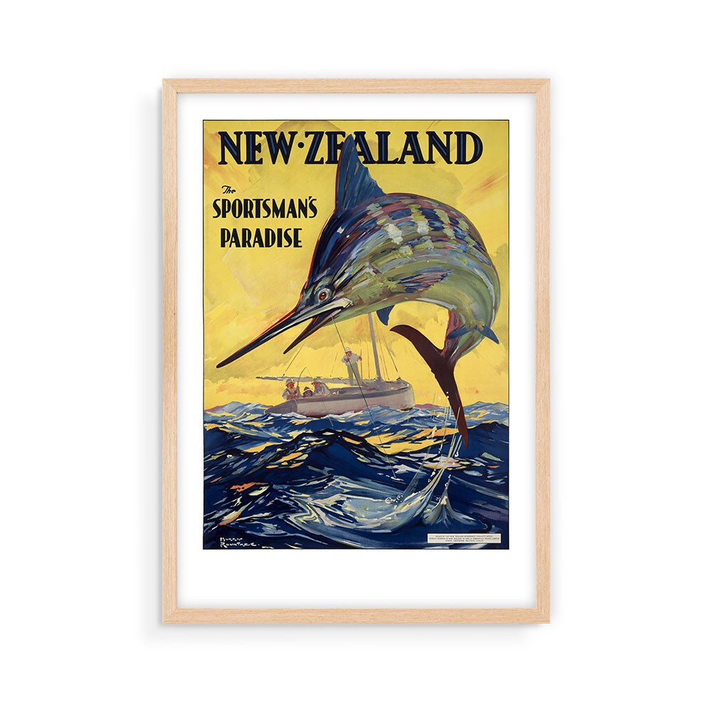 The Sportsman's Paradise Tourist Print is a framed vintage-style archival poster showing a large marlin leaping before a fishing boat, with the text “NEW ZEALAND, The Sportsman’s Paradise” on a yellow sky—perfect for New Zealand poster collectors.