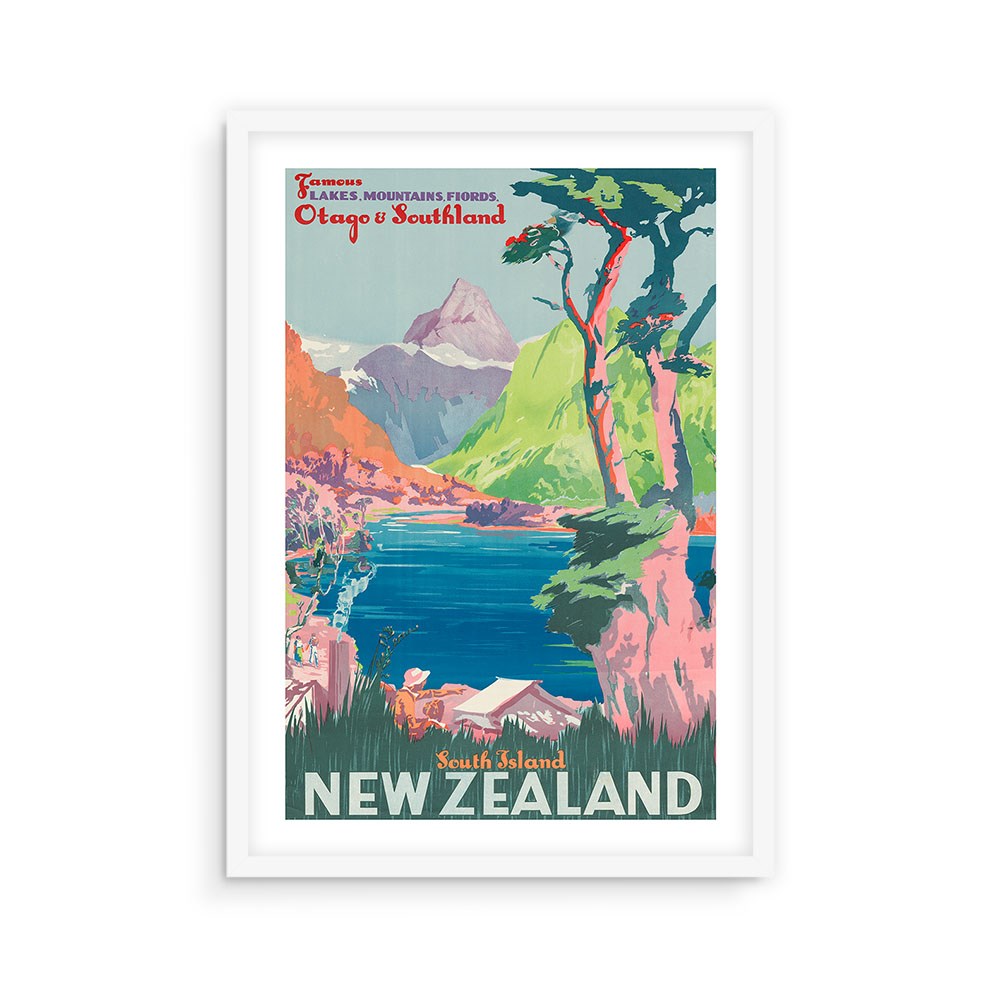 The South Island NZ Tourist Print is a framed vintage-style travel poster with a colorful New Zealand landscape—mountains, lake, trees, and canoe. Archival quality for poster collectors. Text: Famous Lakes Mountains Fiords, Otago & Southland, South Island.