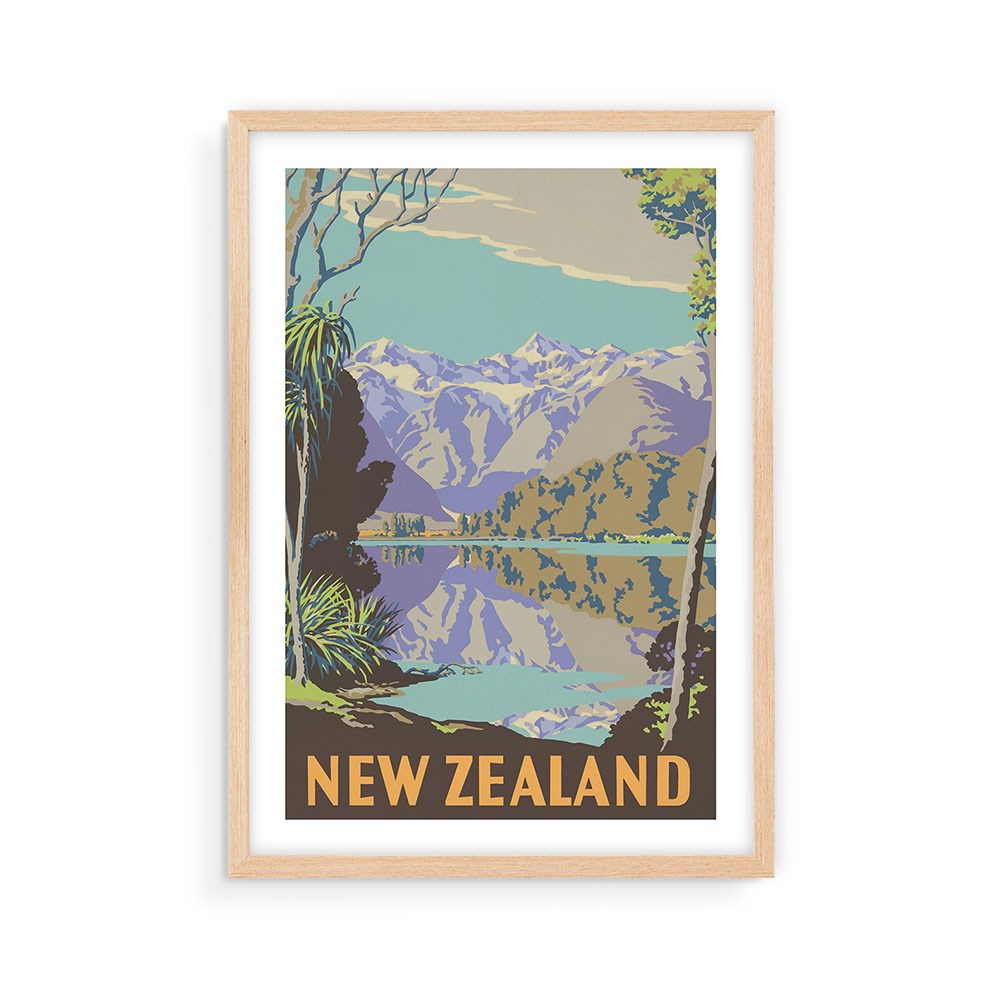 The Lake Matheson Tourist Print is a framed, collectable poster with a vintage pastel illustration of a lake, trees, and mountains. NEW ZEALAND is featured in bold orange letters at the bottom, making it an eye-catching archival display piece.