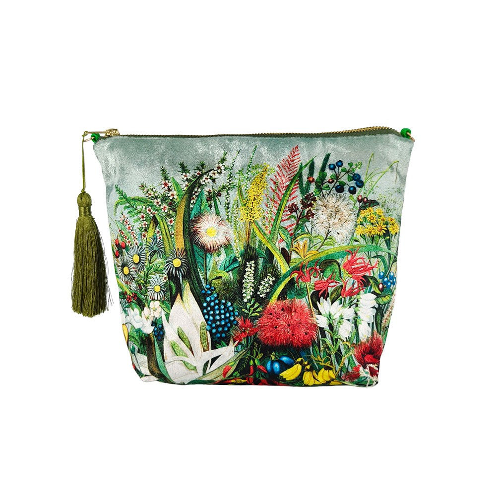 The NZ Native Flowers Velvet Cosmetic Bag features a green tassel and colorful botanical print on a light background. Designed in New Zealand, it’s a stylish, versatile accessory and makes an ideal gift for any occasion.