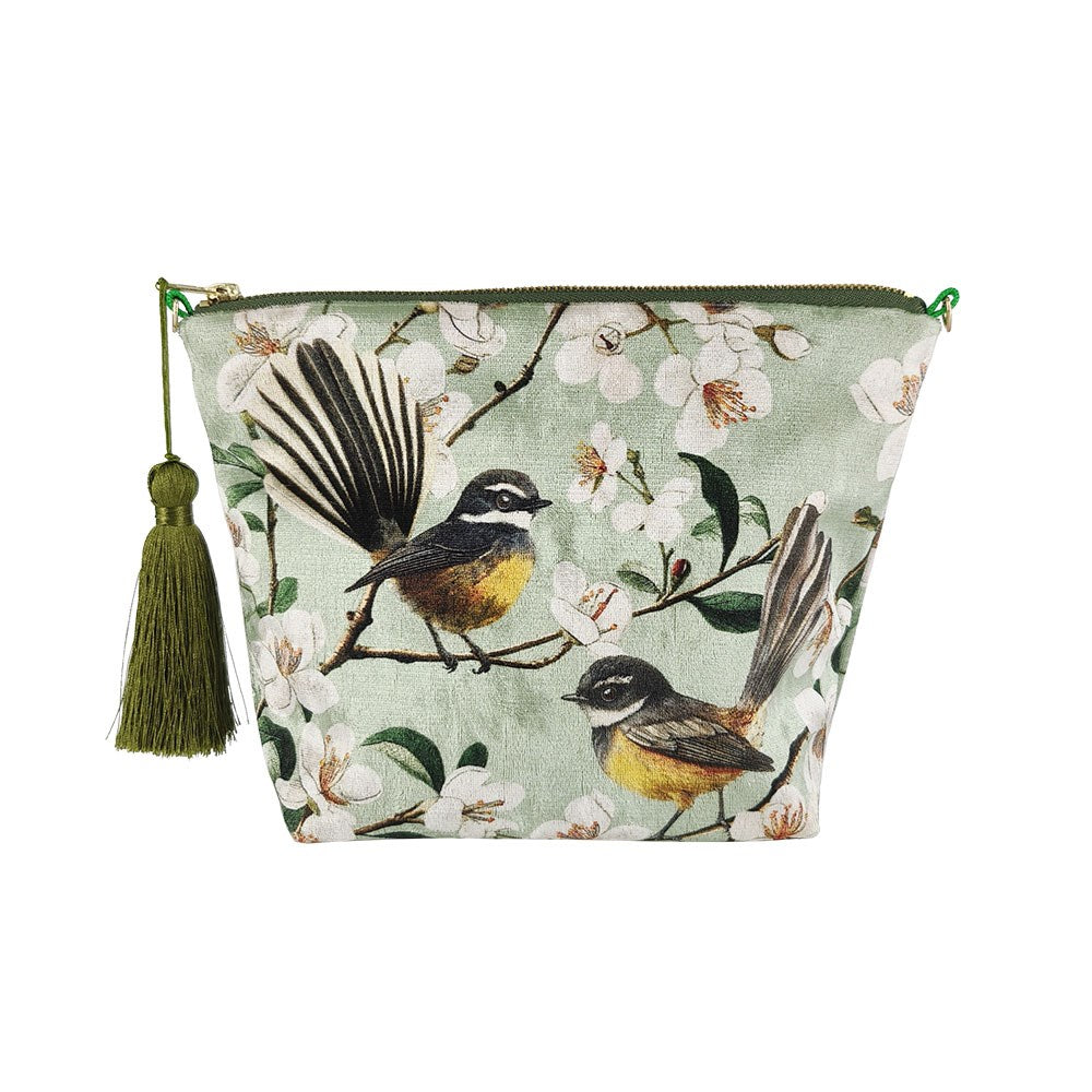 The Chatty Fantails Velvet Cosmetic Bag is a stylish New Zealand-designed pouch with a green tassel and bird-and-blossom illustration on light green—ideal as a charming gift.