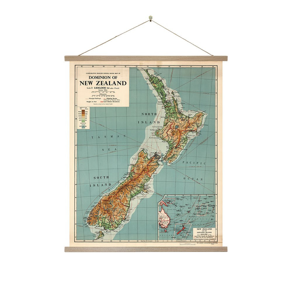 The NZ Dominion Map Wall Chart is a vintage-style topographic map of New Zealand featuring elevation, major cities, and nearby waters. Ready to hang in a wooden frame, it includes a small inset map at the bottom right.