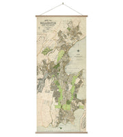 The Wellington Wall Chart is a vintage-style map of Wellington, New Zealand, featuring streets, neighborhoods, parks, and landmarks. It’s mounted between two wooden bars with a string for easy hanging.