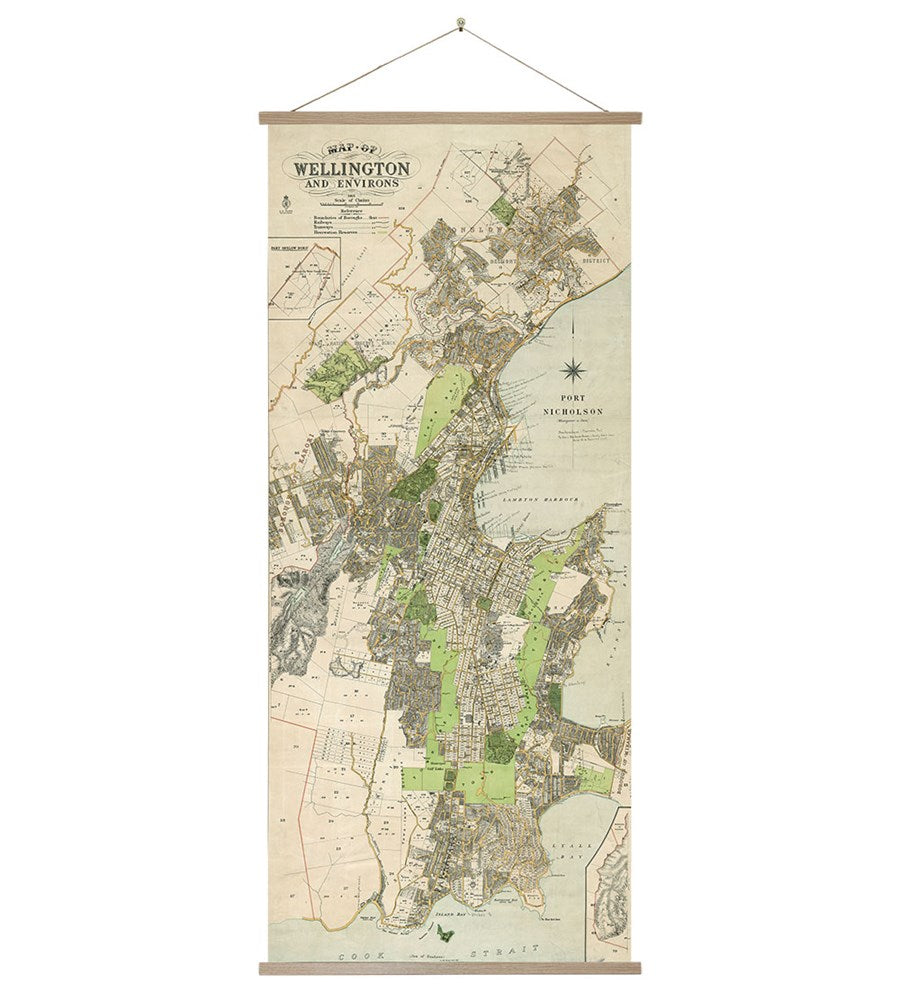 The Wellington Wall Chart is a vintage-style map of Wellington, New Zealand, featuring streets, neighborhoods, parks, and landmarks. It’s mounted between two wooden bars with a string for easy hanging.