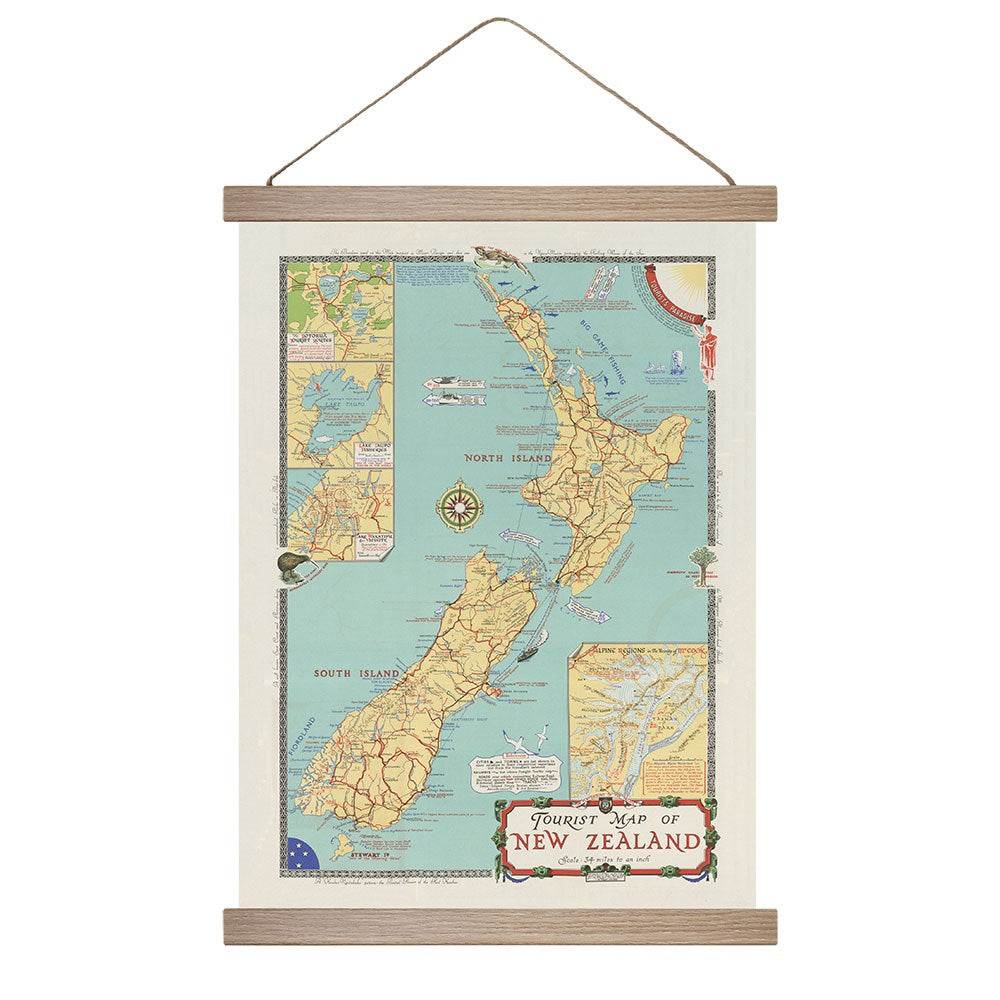 The New Zealand Tourist Map Wall Chart is a vintage-style map with labeled regions, roads, and detailed insets, mounted in a wooden frame with string for easy hanging.
