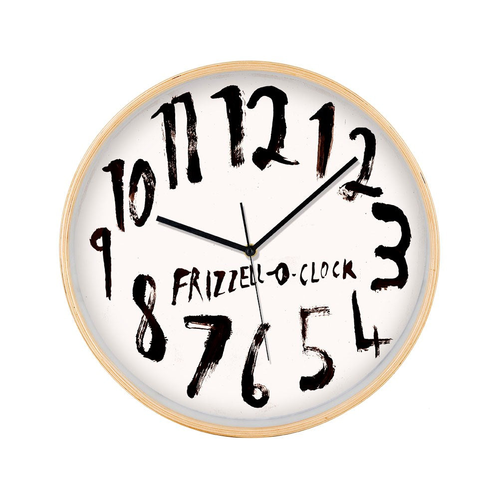 The Dick Frizzell - OClock White Face Wooden Framed Clock features a light wood finish, irregularly painted and spaced numbers, and FRIZZELL-O-CLOCK in black across the center as a nod to Dick Frizzell.