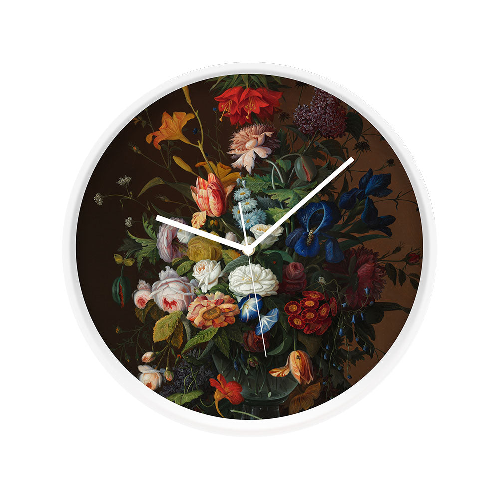 The Vintage Flowers Wooden Frame Clock displays a detailed arrangement of colorful vintage blooms at the center. Featuring a wooden frame and silent movement, the clock’s time is set to approximately 1:50.