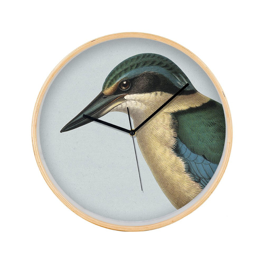 The Hushed Blue Kingfisher Wooden Frame Clock features a light finish, Kingfisher illustration, black hands, and silent movement—making it a charming, peaceful décor piece. The time displayed is approximately 10:12:30.