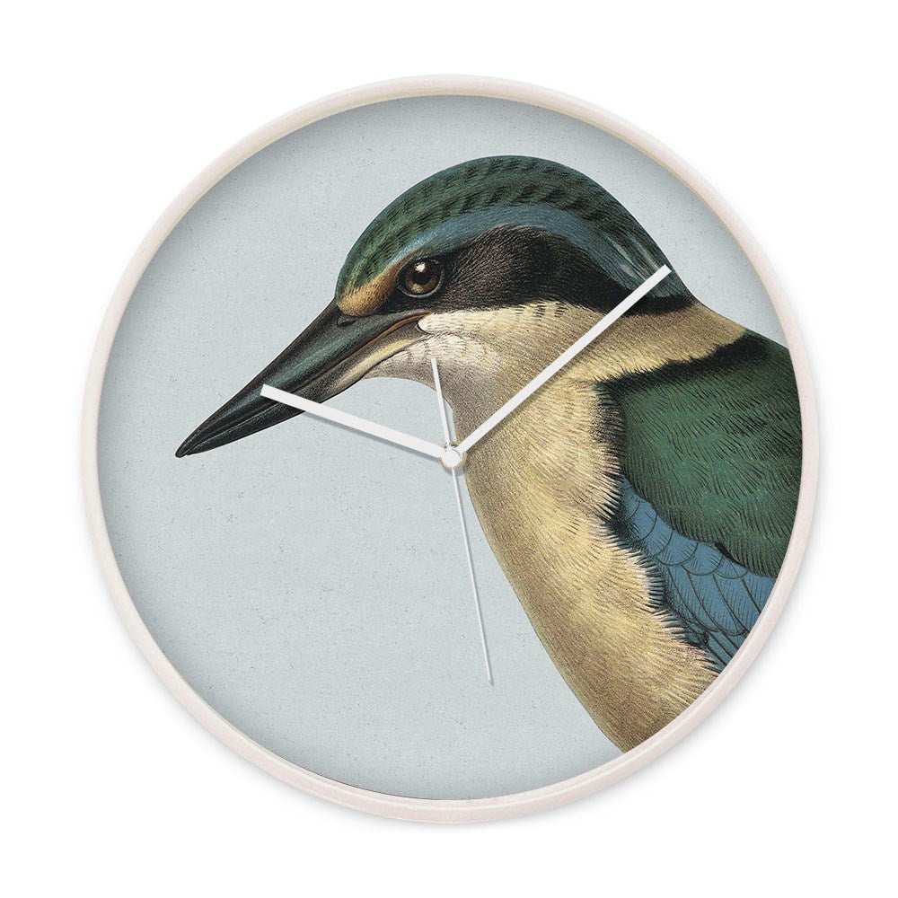 The Hushed Blue Kingfisher Wooden Frame Clock features a silent movement and showcases a detailed profile illustration of New Zealands Kingfisher, with its head and upper body set against a minimal background.