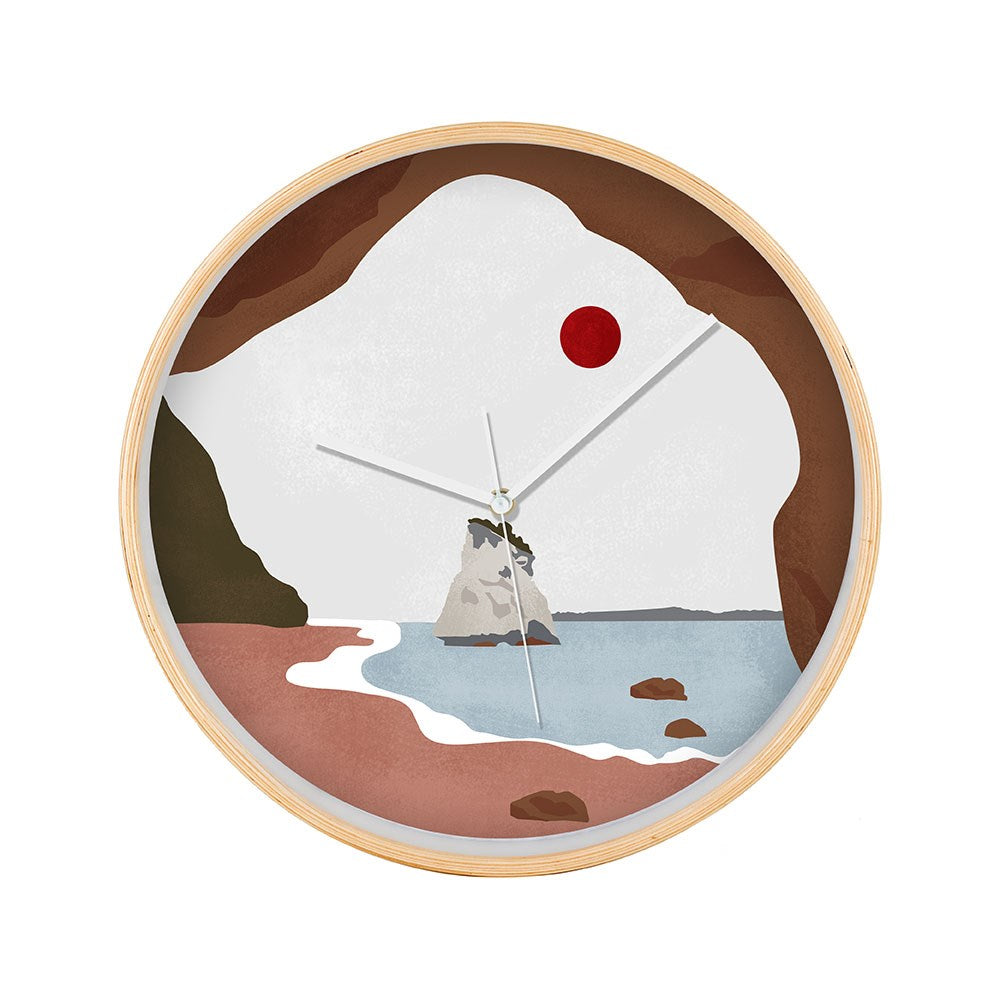 The Cathedral Cove Landmark Wooden Frame Clock showcases an illustration of New Zealand’s Cathedral Cove as seen from a cave, with blue water, rocky formations, a red sun, and features white hour, minute, and second hands.