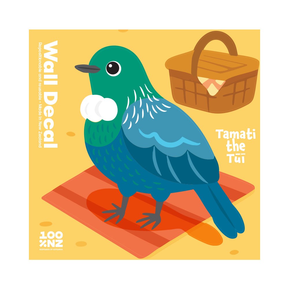 Illustration of a green and blue bird with white neck feathers, standing on a red mat with picnic basket behind. Text: Tui Wall Decal—repositionable wall art, 100% NZ made, matte fabric finish.