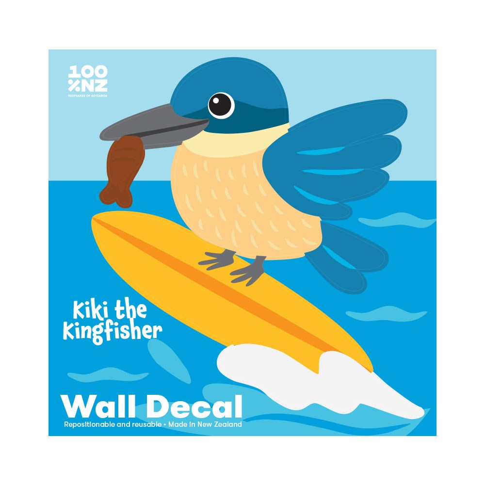 An illustrated kingfisher with blue wings holds a fish in its beak while standing on a yellow surfboard in the sea. “Kiki the Kingfisher” and “Wall Decal” appear in white on this peel and stick, repositionable Kingfisher Wall Decal.