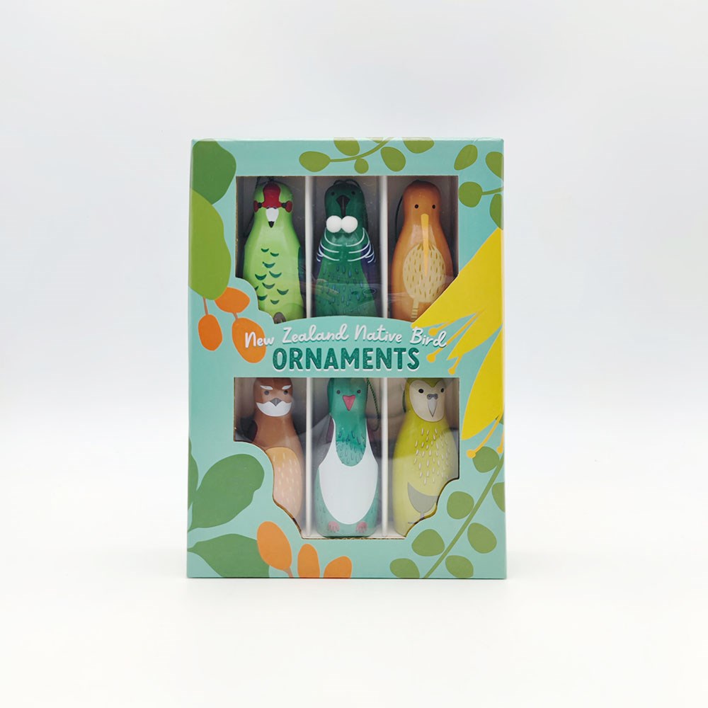 The Box of Native Bird Ornaments - Seconds includes six illustrated New Zealand native bird designs in a pastel green and yellow box with leaf patterns. Limited stock available.