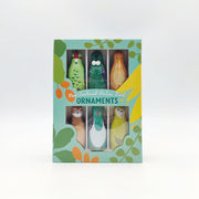 The Box of Native Bird Ornaments - Seconds includes six illustrated New Zealand native bird designs in a pastel green and yellow box with leaf patterns. Limited stock available.