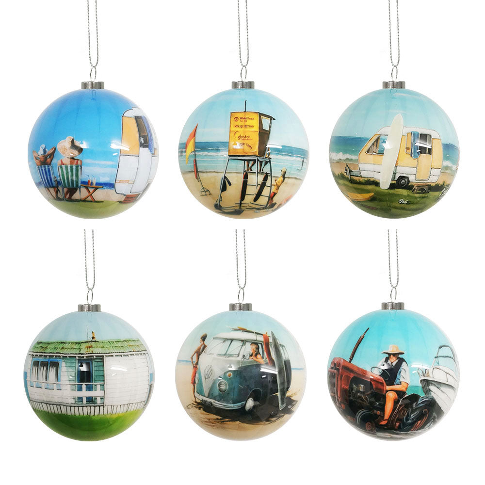 The Box of Six NZ Summer Christmas Baubles - Second features lightweight glass ornaments in two rows, displaying Graham Young-inspired beach and camping scenes with caravans, campers, boats, and outdoor relaxation.