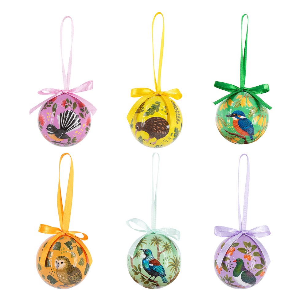 A boxed set of Birds and Botanicals Mini Christmas Baubles featuring six round ornaments with colorful illustrations of New Zealand native birds and plants, each with a matching ribbon hanger and bow.