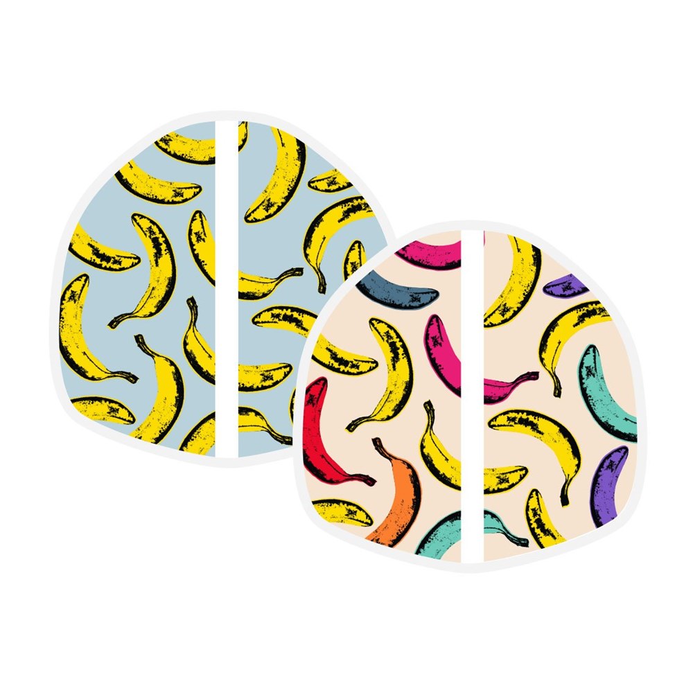The Pop Art Banana Lunch Wrap is shown in two styles: one with yellow bananas on light blue, the other with multicolored bananas on cream. Each is made from food-safe certified materials and features a playful banana pattern.