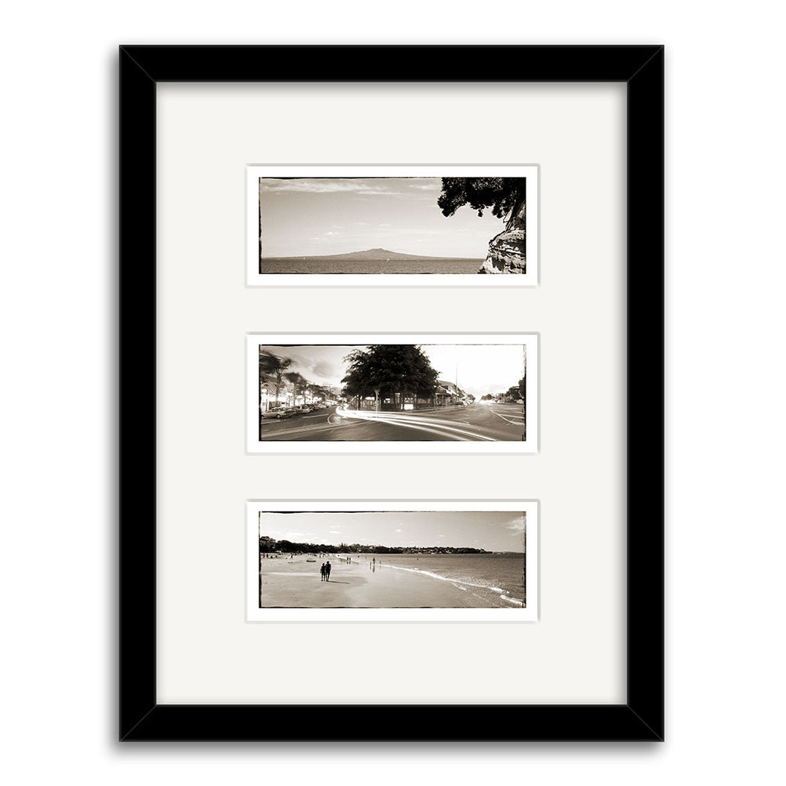 The Takapuna Triptych - RP088 features three black-and-white panoramic outdoor New Zealand prints by Reuben Price, arranged vertically with white matting and set in a sleek black frame.
