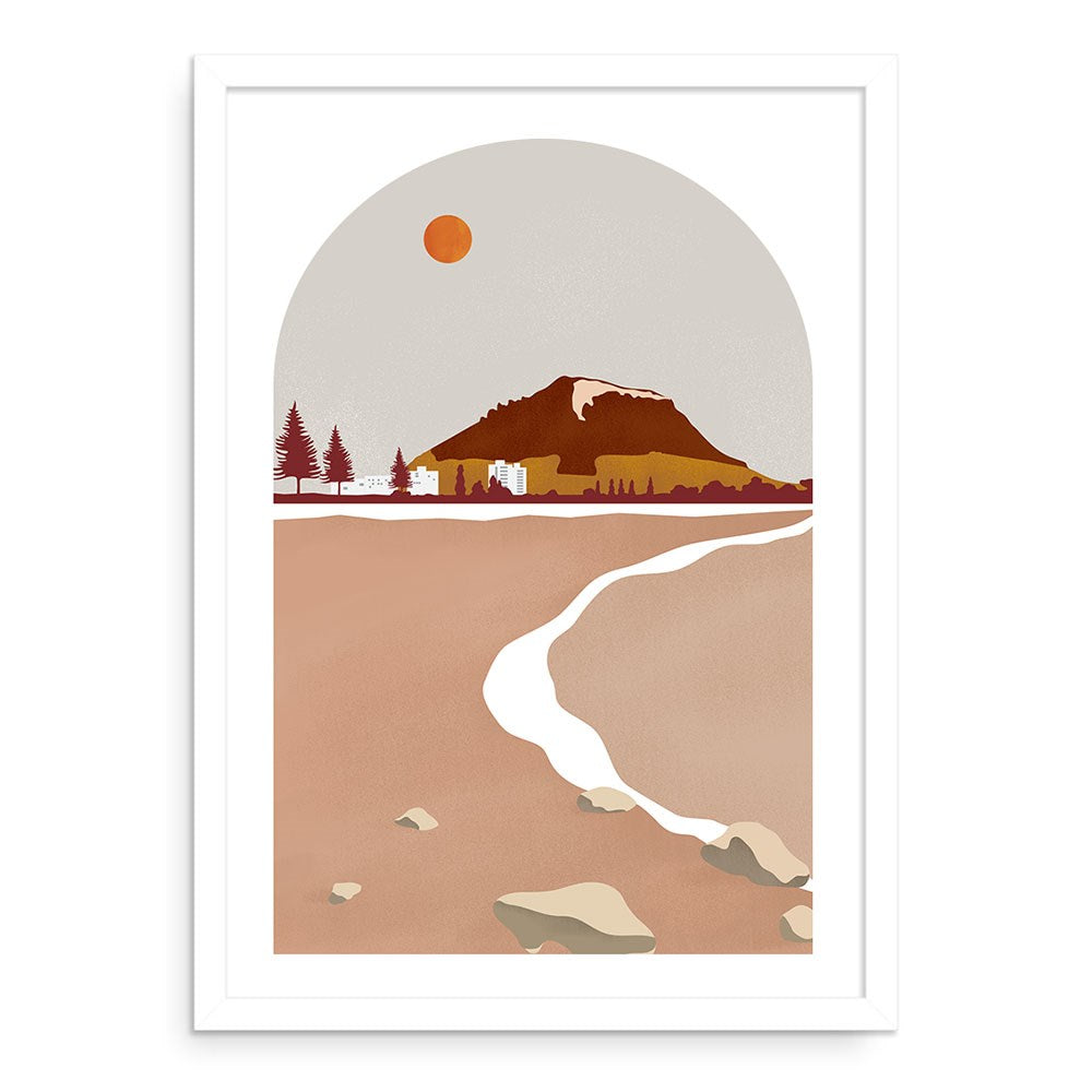 The Mt Manganui Landmark A2 Print features a minimalist illustration with a snow-capped mountain, buildings, trees, and winding river beneath an orange sun in a gray sky. Part of the Landmark Collection showcasing New Zealands favourite spots. Unframed.