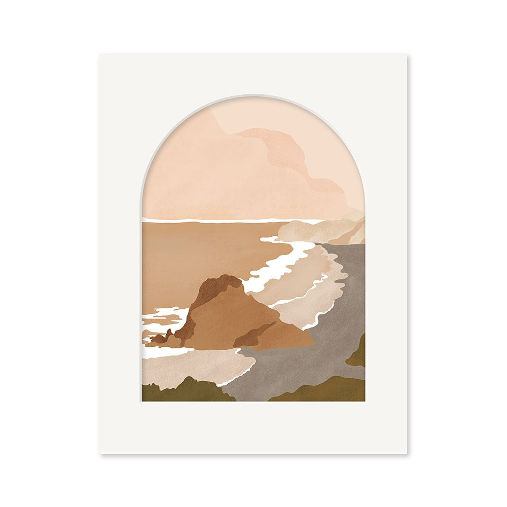 The Piha Landmark Art Print depicts a minimalist view of a rocky New Zealand coastline with waves and cliffs, framed by an arched white border. Part of the Landmark Collection, it features muted earth tones of beige, brown, and green.