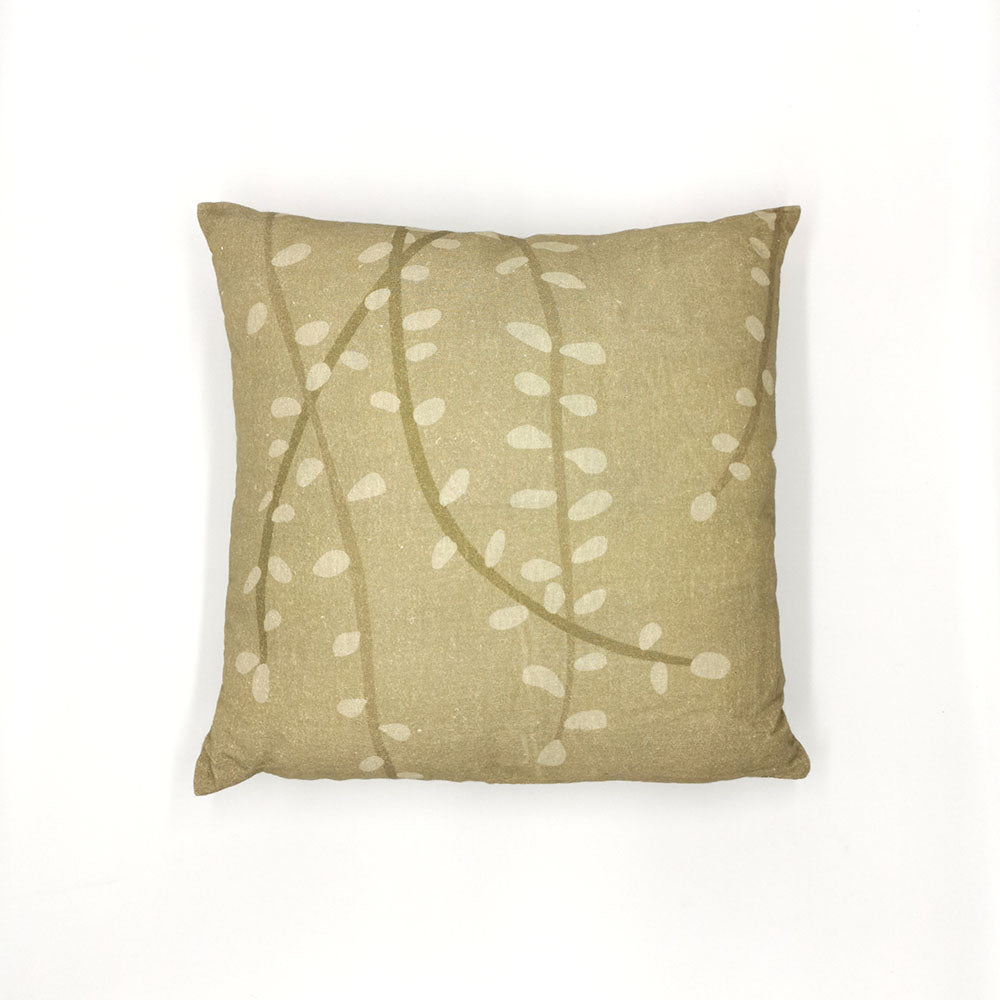 The Raw Kowhai Linen Cushion Cover is a square beige pillow cover made from natural linen, featuring a subtle pattern of white curved lines and oval shapes inspired by New Zealand native flora, photographed on a plain white background.