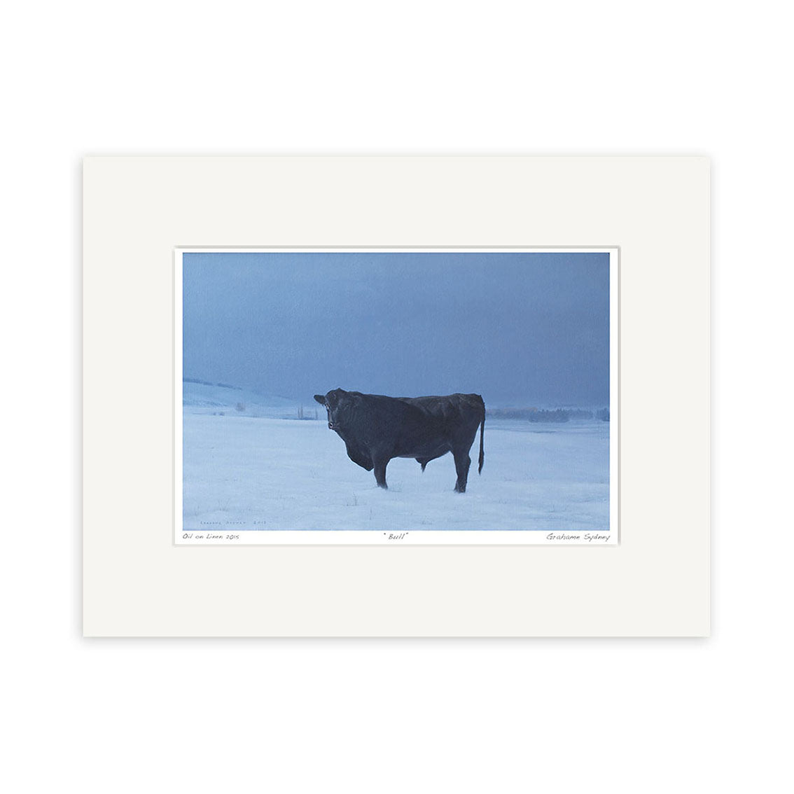 The Grahame Sydney - Bull Small Art Print features a solitary black bull in a snowy landscape beneath a blue-clouded sky, evoking calm and quiet with distant hills—ideal for art lovers seeking serene New Zealand-inspired scenes.